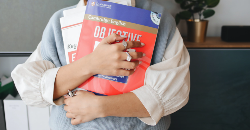 hands holding books for studying